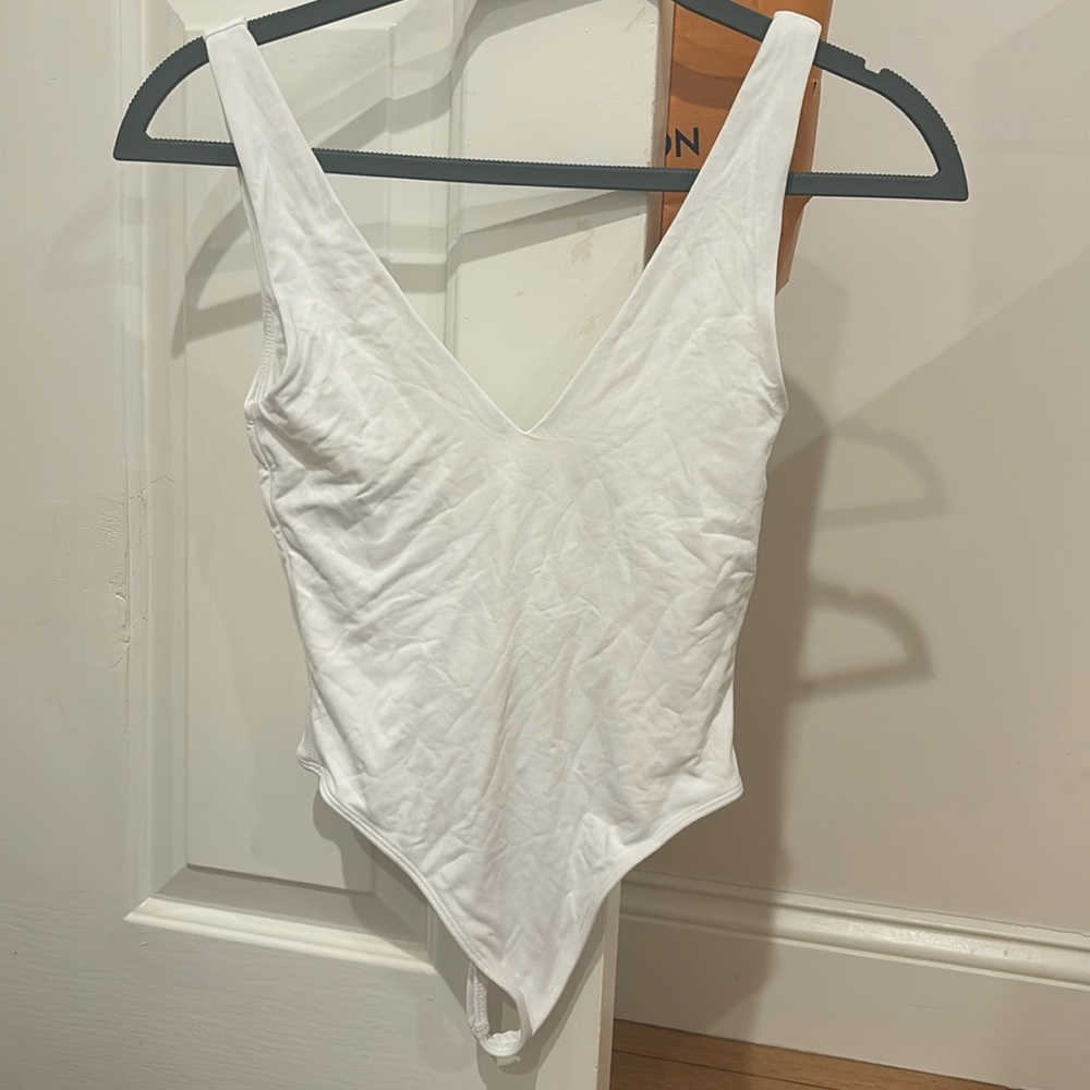 super cute white bodysuit from aritzia, worn once, size xs